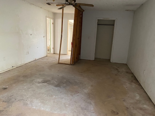 207 County Road 1739, Yantis, TX 75497 - unfurnished bedroom with unfinished concrete flooring and ceiling fan