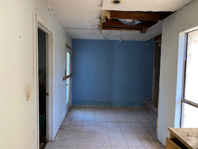 207 County Road 1739, Yantis, TX 75497 - spare room featuring plenty of natural light and light tile patterned floors