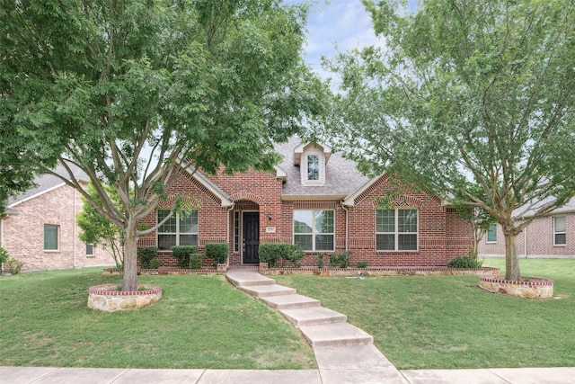 1056 Enchanted Rock Dr, Allen, TX 75013 - view of front of home with brick siding, a front lawn, and roof with shingles
