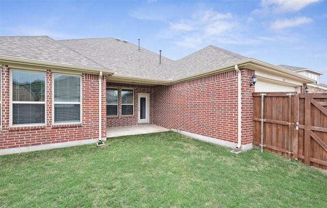 1056 Enchanted Rock Dr, Allen, TX 75013 - rear view of house with a shingled roof, brick siding, a gate, a garage, and a patio