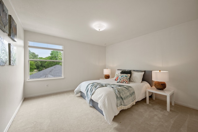 bedroom with carpet and baseboards