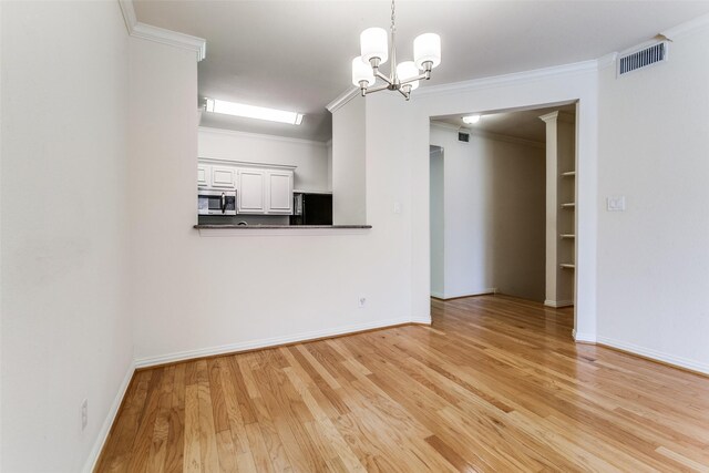 2524 Preston Rd Unit 204, Plano, TX 75093 - unfurnished room featuring light wood finished floors, a chandelier, baseboards, and ornamental molding