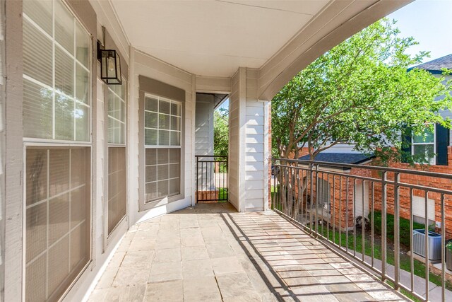 2524 Preston Rd Unit 204, Plano, TX 75093 - balcony featuring covered porch and central air condition unit