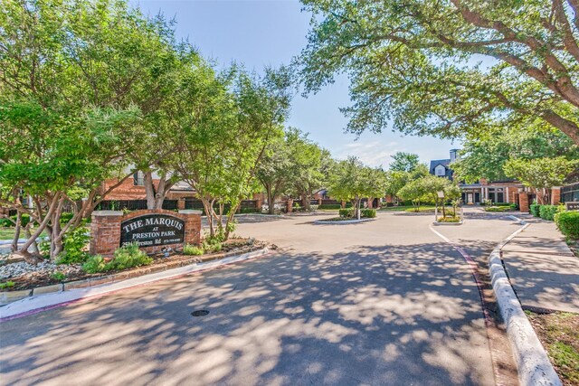 2524 Preston Rd Unit 204, Plano, TX 75093 - view of asphalt road featuring curbs and a gated entry