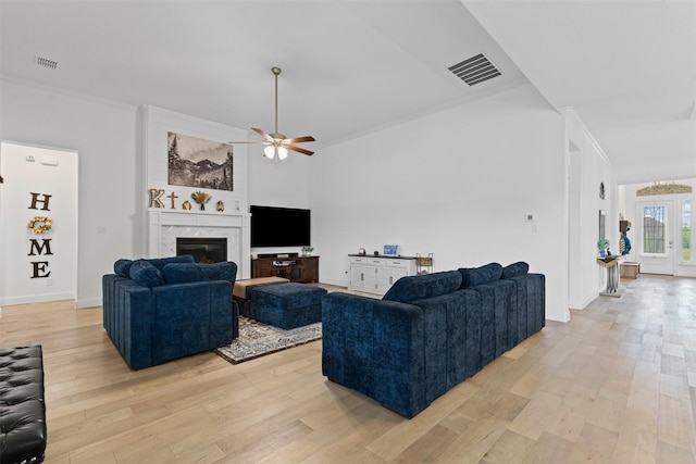 7020 Valley View Dr, Joshua, TX 76058 - living room featuring light wood-type flooring, ceiling fan, ornamental molding, and a fireplace