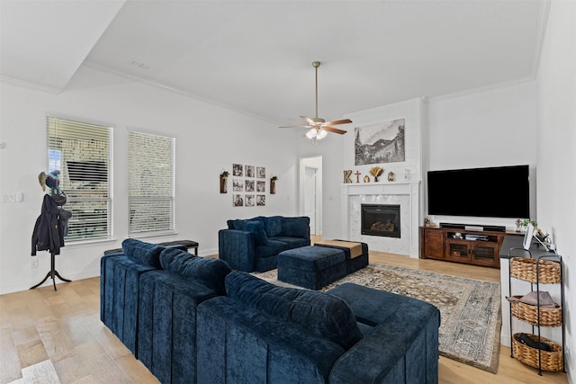 7020 Valley View Dr, Joshua, TX 76058 - living room featuring a ceiling fan, crown molding, light wood finished floors, and a premium fireplace