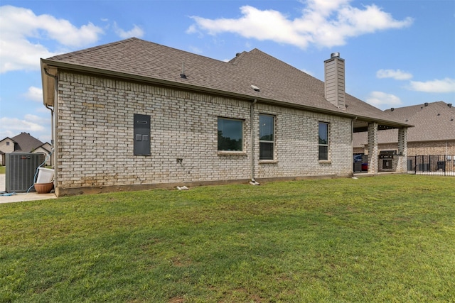 7020 Valley View Dr, Joshua, TX 76058 - back of house featuring a chimney, roof with shingles, central AC, and brick siding