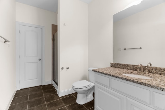 8204 Saint Clair Dr, Mckinney, TX 75071 - bathroom featuring vanity, tile patterned floors, a stall shower, toilet, and baseboards
