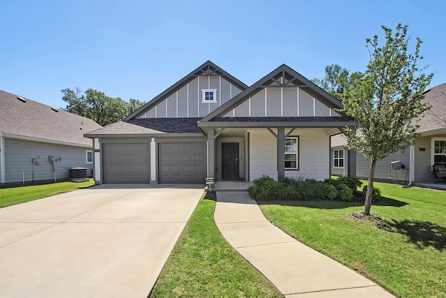 115 Rock Creek Ln, Terrell, TX 75160 - view of front of property featuring board and batten siding, a garage, a front lawn, driveway, and covered porch