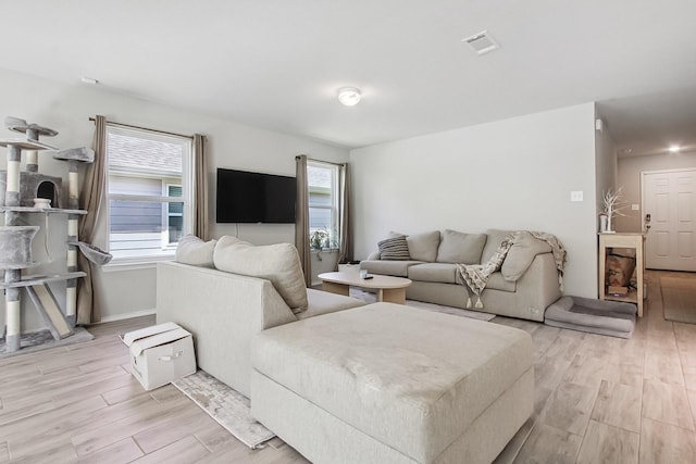 115 Rock Creek Ln, Terrell, TX 75160 - living area featuring light wood-style flooring and baseboards