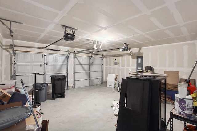 115 Rock Creek Ln, Terrell, TX 75160 - garage featuring a garage door opener and electric panel