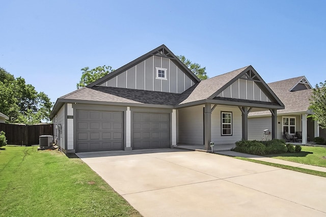 115 Rock Creek Ln, Terrell, TX 75160 - view of front of home featuring central AC unit, an attached garage, board and batten siding, concrete driveway, and roof with shingles