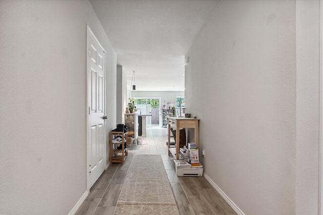 115 Rock Creek Ln, Terrell, TX 75160 - corridor featuring wood finished floors and baseboards