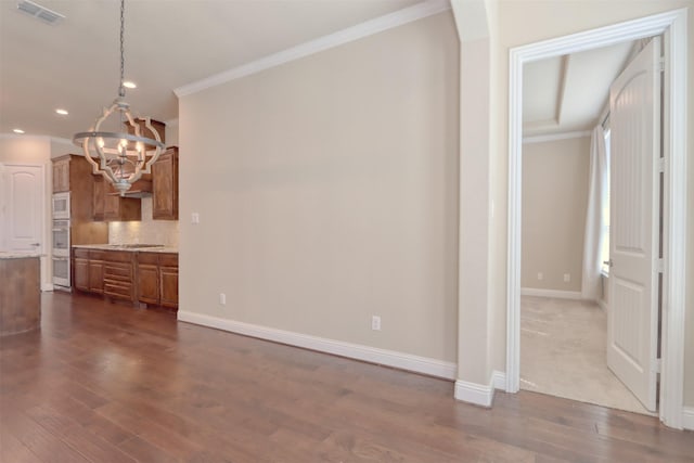 1306 Prato Ave, Mclendon Chisholm, TX 75032 - unfurnished dining area featuring a chandelier, crown molding, baseboards, dark wood finished floors, and recessed lighting