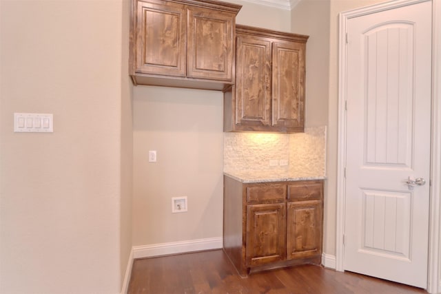 1306 Prato Ave, Mclendon Chisholm, TX 75032 - kitchen with decorative backsplash, dark wood-style floors, light stone counters, and baseboards
