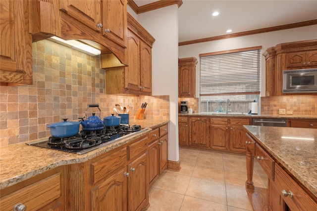 1607 Navarro Ct, Allen, TX 75013 - kitchen with appliances with stainless steel finishes, a sink, crown molding, brown cabinetry, and recessed lighting