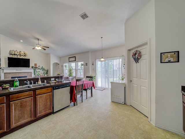 3929 Bonita Springs Dr, Fort Worth, TX 76123 - kitchen with dishwasher, a sink, dark countertops, a ceiling fan, and arched walkways