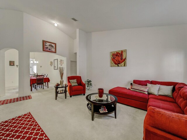 3929 Bonita Springs Dr, Fort Worth, TX 76123 - living area featuring arched walkways, carpet, and lofted ceiling
