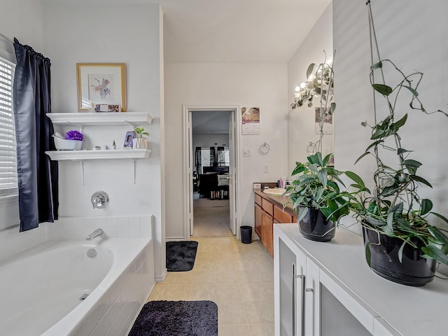 3929 Bonita Springs Dr, Fort Worth, TX 76123 - ensuite bathroom featuring vanity, a garden tub, and tile patterned floors