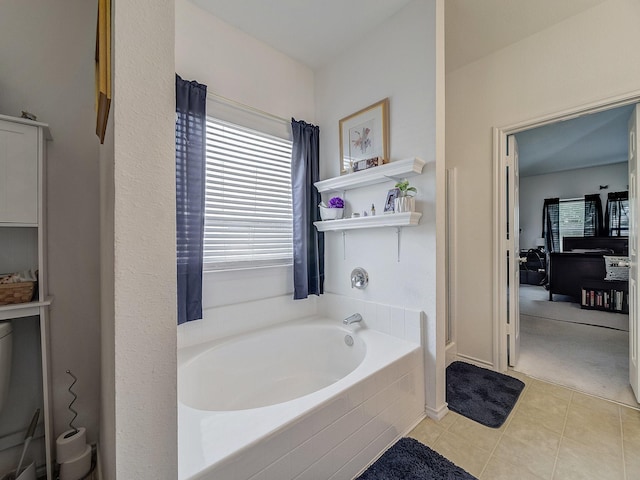 3929 Bonita Springs Dr, Fort Worth, TX 76123 - bathroom featuring a bath and tile patterned floors