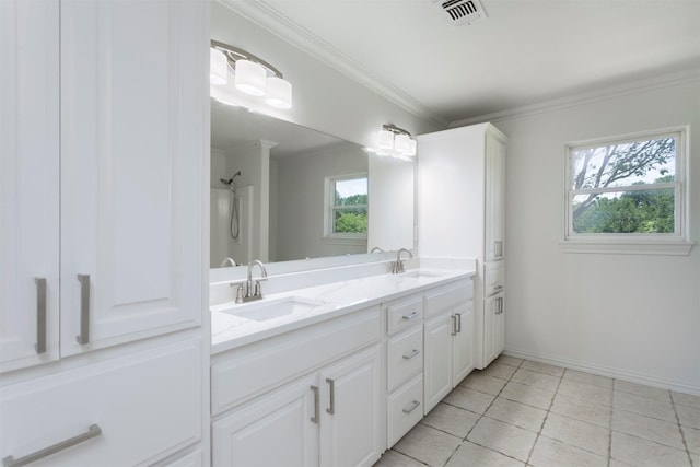 943 Lone Star Rd, Whitesboro, TX 76273 - full bath with crown molding, double vanity, baseboards, tile patterned floors, and a shower