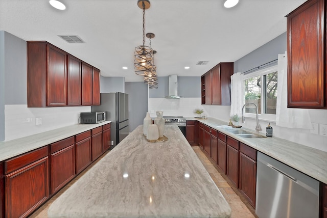 2200 Bantry Ln, Arlington, TX 76002 - kitchen featuring stainless steel appliances, a sink, wall chimney exhaust hood, a kitchen island, and dark brown cabinets