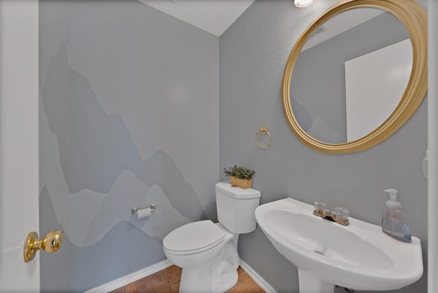 2200 Bantry Ln, Arlington, TX 76002 - half bathroom featuring a sink, toilet, baseboards, and tile patterned floors