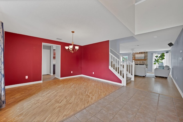 2200 Bantry Ln, Arlington, TX 76002 - foyer featuring wood finished floors, a chandelier, ceiling fan, baseboards, and stairs