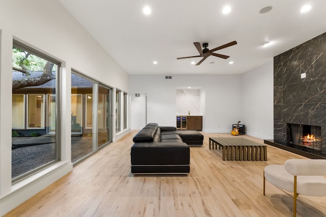 9415 Hill View Dr, Dallas, TX 75231 - living area featuring wood finished floors, a high end fireplace, recessed lighting, a ceiling fan, and baseboards