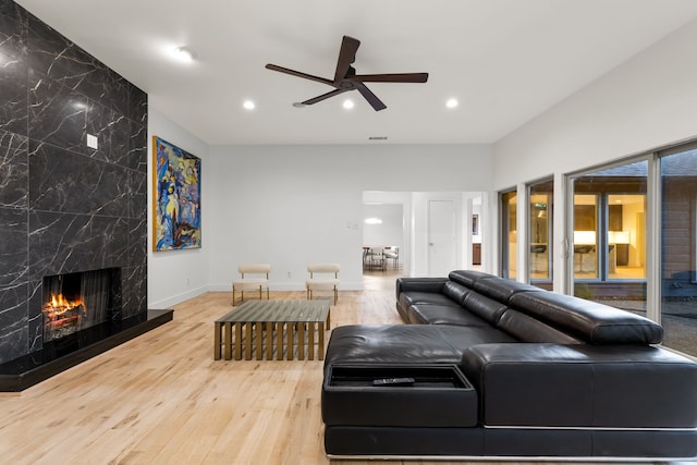 9415 Hill View Dr, Dallas, TX 75231 - living room featuring ceiling fan, wood finished floors, a high end fireplace, recessed lighting, and baseboards