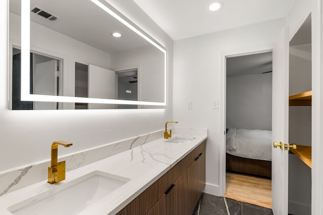 9415 Hill View Dr, Dallas, TX 75231 - bathroom with recessed lighting, double vanity, ensuite bathroom, and marble finish flooring