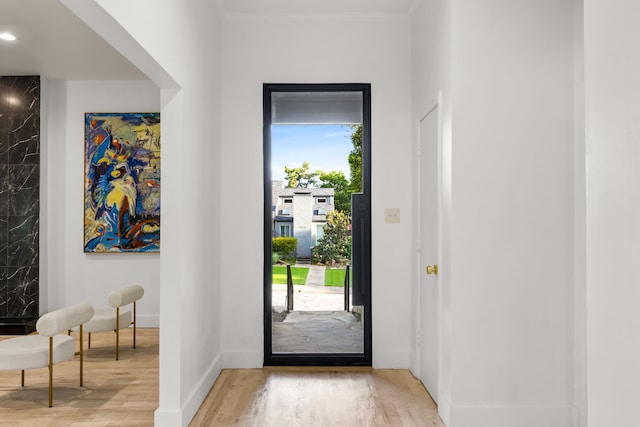 9415 Hill View Dr, Dallas, TX 75231 - doorway featuring light wood-style floors and baseboards