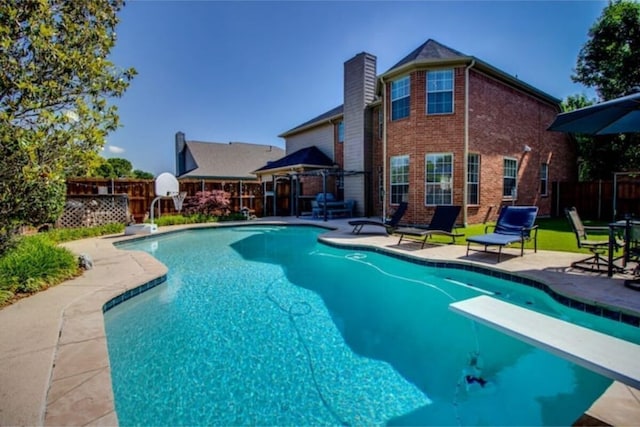 2505 Wilma Ln, Plano, TX 75074 - view of pool with a patio area and a diving board