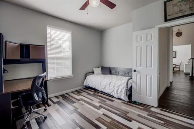 2505 Wilma Ln, Plano, TX 75074 - bedroom with wood finished floors, an office area, and ceiling fan