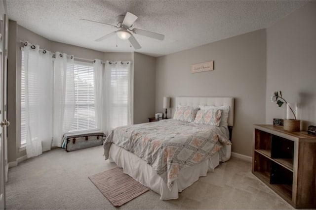 2505 Wilma Ln, Plano, TX 75074 - carpeted bedroom featuring a textured ceiling and a ceiling fan