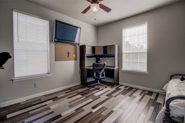2505 Wilma Ln, Plano, TX 75074 - bedroom with wood finished floors, an office area, and ceiling fan