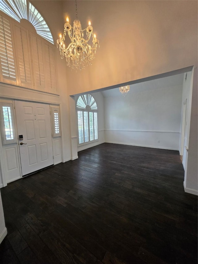 2505 Wilma Ln, Plano, TX 75074 - entryway featuring a chandelier, a high ceiling, and dark wood-style floors