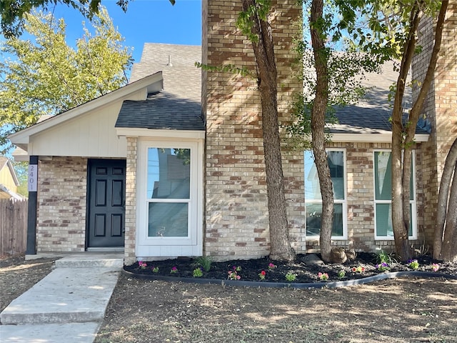2401 Sherry St Unit A & B, Arlington, TX 76014 - view of front of home featuring a shingled roof, brick siding, and fence