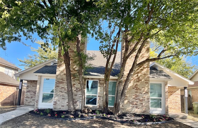 2401 Sherry St Unit A & B, Arlington, TX 76014 - view of front facade with brick siding, roof with shingles, and a chimney