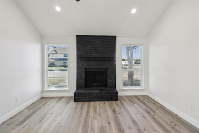 2401 Sherry St Unit A & B, Arlington, TX 76014 - unfurnished living room featuring vaulted ceiling, baseboards, wood finished floors, a brick fireplace, and recessed lighting