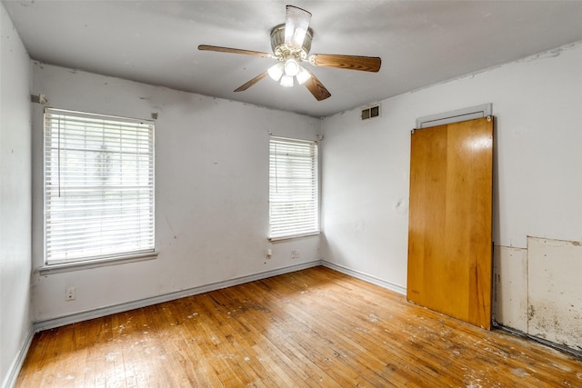 1231 Arizona Ave, Dallas, TX 75216 - empty room with hardwood / wood-style floors, ceiling fan, and baseboards