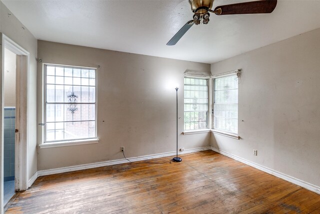 1231 Arizona Ave, Dallas, TX 75216 - empty room featuring hardwood / wood-style flooring, a ceiling fan, and baseboards