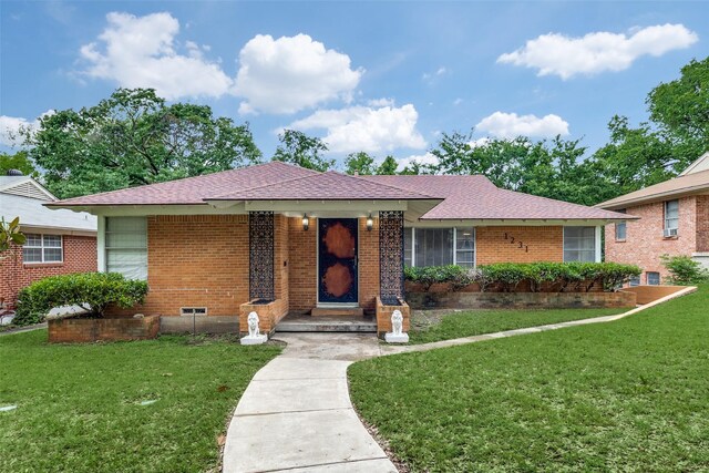 1231 Arizona Ave, Dallas, TX 75216 - ranch-style house with a front lawn and brick siding
