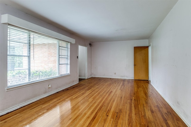 1231 Arizona Ave, Dallas, TX 75216 - empty room with wood finished floors and baseboards