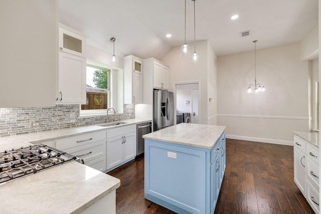 102 Fontana Ct, Allen, TX 75013 - kitchen featuring stainless steel appliances, a sink, washer and clothes dryer, backsplash, and white cabinetry