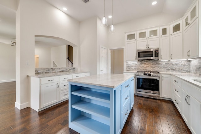 102 Fontana Ct, Allen, TX 75013 - kitchen with stainless steel appliances, open shelves, tasteful backsplash, white cabinets, and recessed lighting