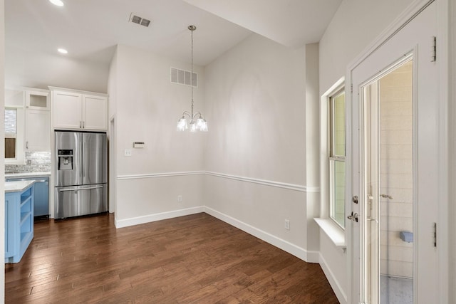 102 Fontana Ct, Allen, TX 75013 - kitchen with stainless steel fridge with ice dispenser, white cabinets, a chandelier, light countertops, and dark wood-style floors