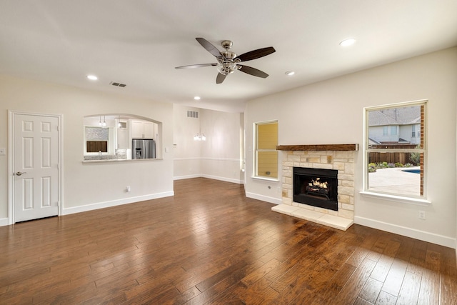 102 Fontana Ct, Allen, TX 75013 - unfurnished living room featuring ceiling fan, a fireplace, recessed lighting, dark wood-type flooring, and baseboards