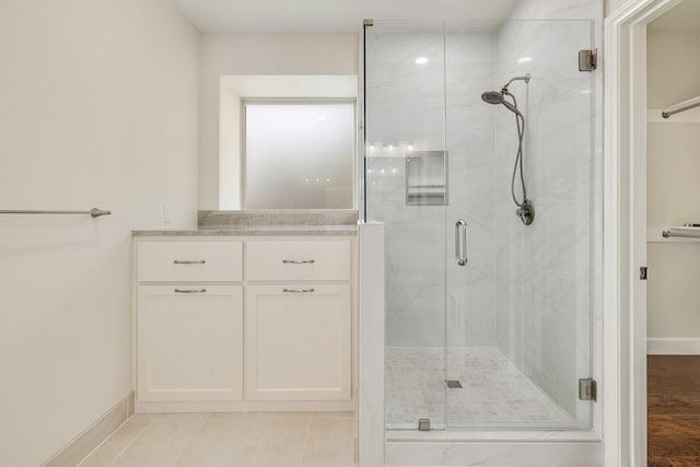 102 Fontana Ct, Allen, TX 75013 - full bath featuring a marble finish shower, baseboards, and vanity