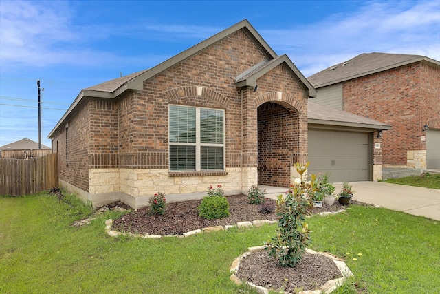 5500 Persimmon Dr, Denton, TX 76207 - view of front of home with brick siding, driveway, an attached garage, and a shingled roof